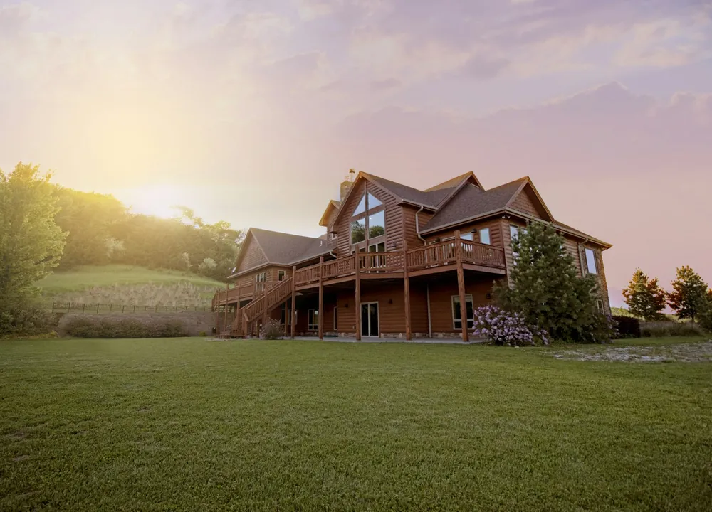 Warm wood home at golden sunset — illustrative